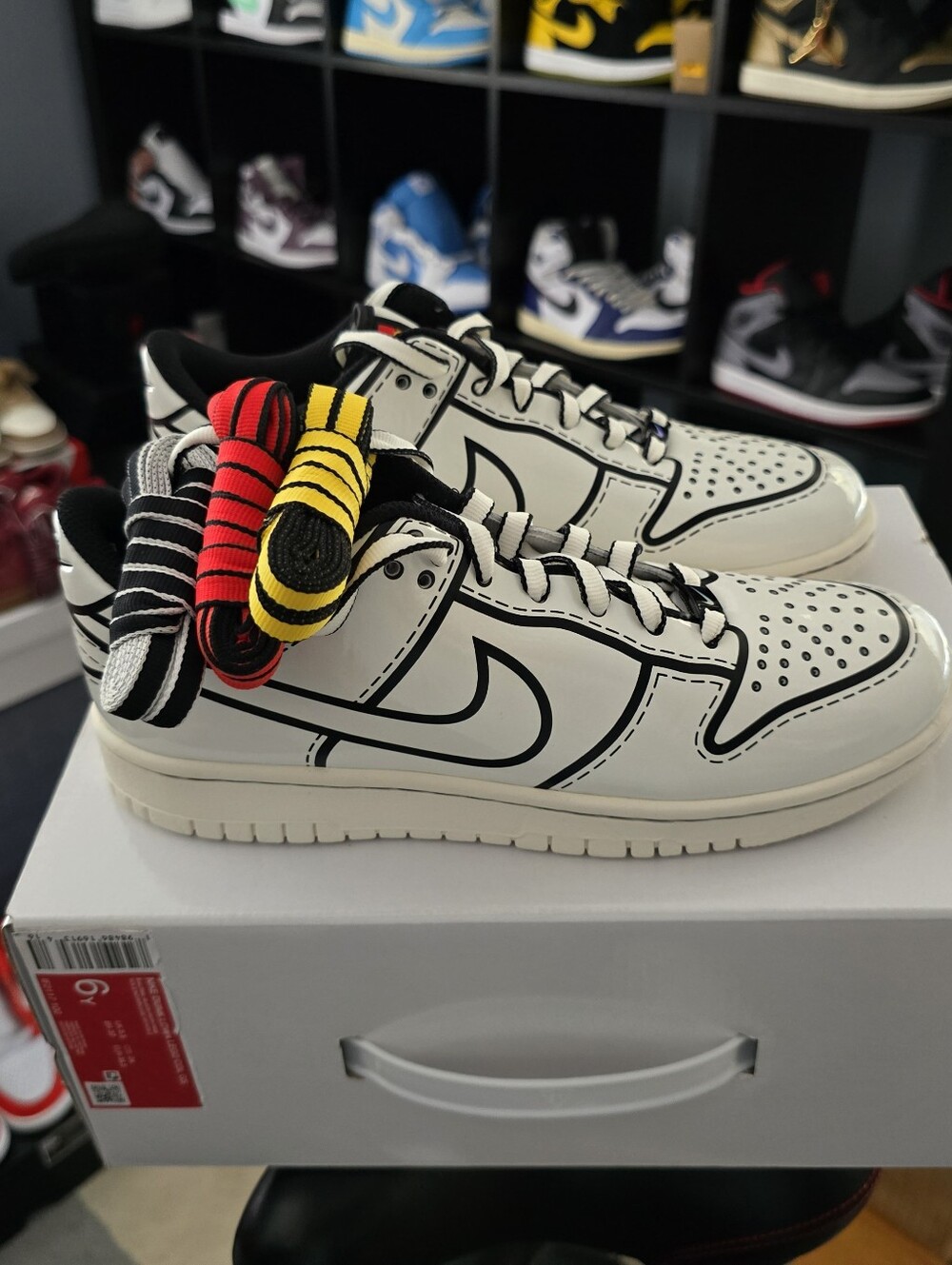 Nike White Low-Top Sneakers with Black Accents and Multi-Color Laces